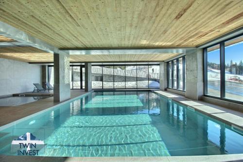 ARC 1600, LE RIDGE, Appartement 07 personnes Vue Montagne - ski aux pieds - Sauna, Hammam, Piscine, Salle de salle de sport-fitness
