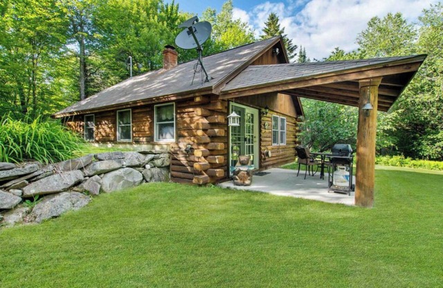 Beautiful 3-bedroom log cabin in Pittsburg with snowmobile and ATV trail access.
