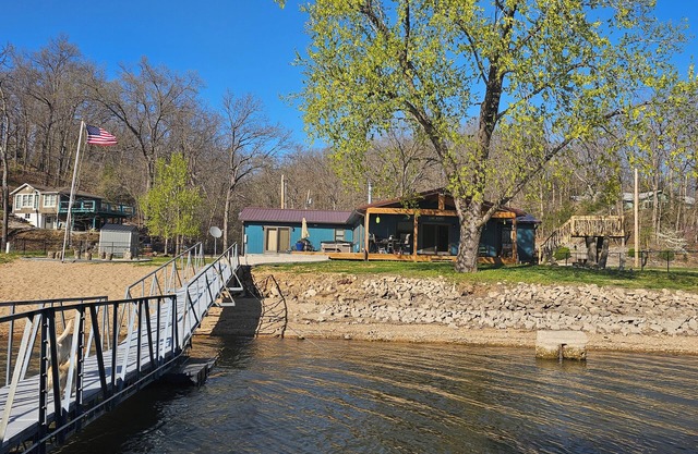 Beautiful 4 bedroom 2 bathroom lakeside cabin with large dock and sandy beach.