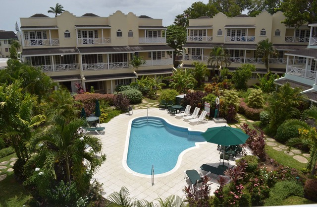 Beautiful Condo with breezy Balcony Overlooking Pool & Garden – Steps to Beach