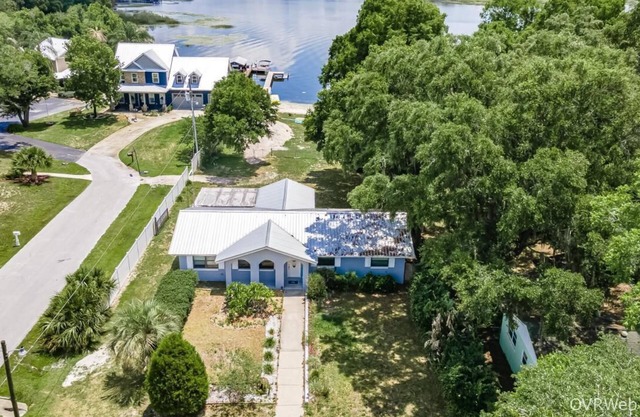Beautiful Lake Weir lakefront 2/2 house with private dock, beach, huge yard.
