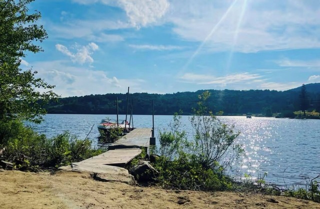 Brand new WATERFRONT home located on First Lake - DIRECT SNOWMOBILE TRAIL ACCESS