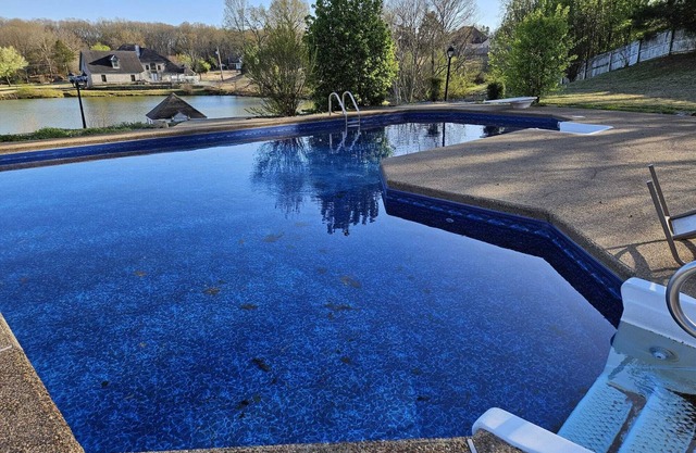 Breathtaking 8 BR Retreat with Private Pool, Lake View, & Expansive Backyard.