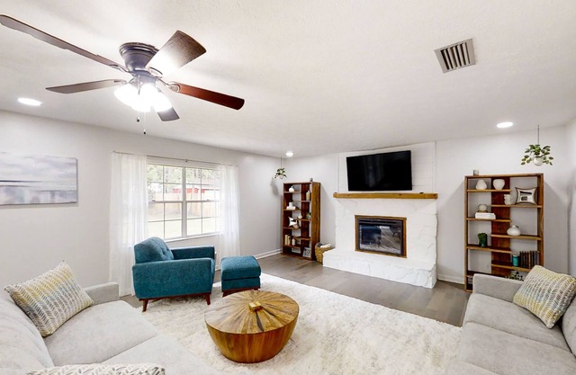 Bright and modern home with a large yard, grill, air hockey table, & fireplace