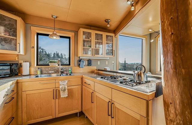 Bright island home with a mountain view, shared pool, & beach access