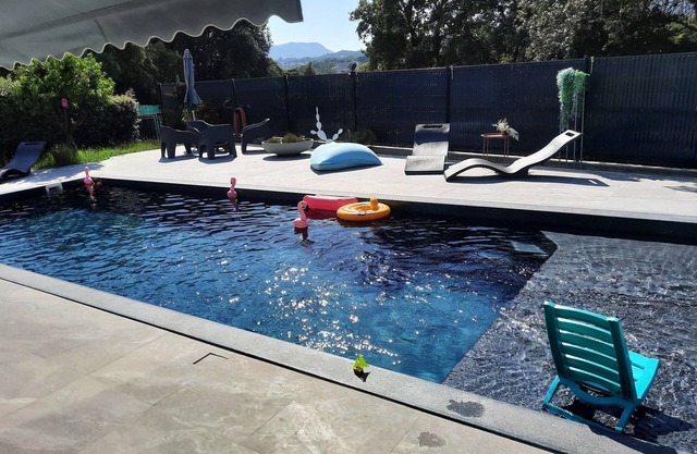 Bungalow rental between land and sea near Ajaccio beaches/pool.