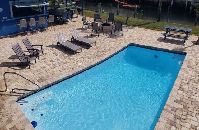 Cabana Escape – Waterfront Oasis with Heated Pool and Spacious Outdoor Living