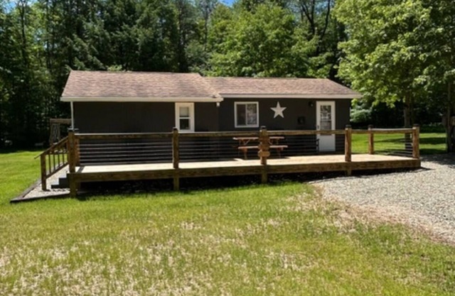 Camp Bear Bottom is a lovingly kept 1950s cabin where families gather to unplug and reconnect. Step inside to find an inviting indoor fireplace, fast Wi-Fi, and a fully equipped kitchen ready for your favorite recipes.