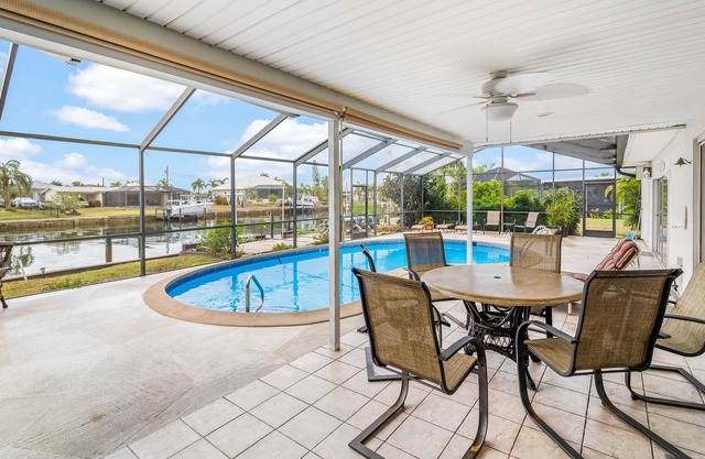 Canal-front home with deep-water dock, pool, lanai, & central AC - snowbirds OK