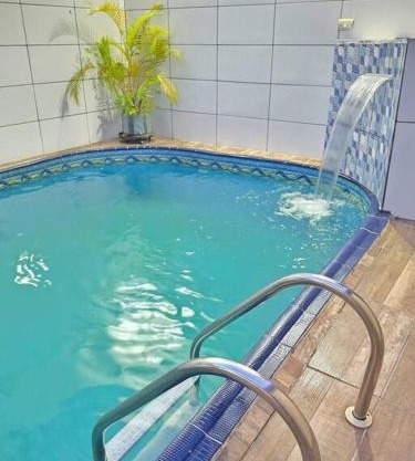 Casa com Piscina Cascata Na Praia Grande