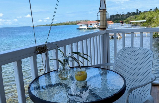 Charming bungalow over a coral reef in the Caribbean sea with stunning sunsets!