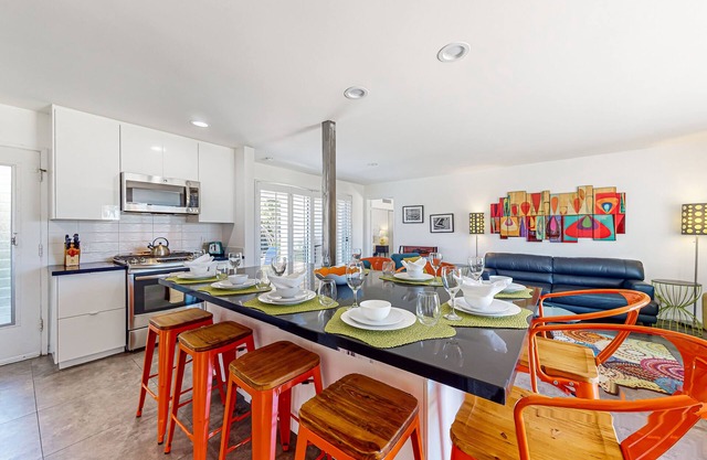 Color-filled charmer with pool & tennis access, patios, and AC