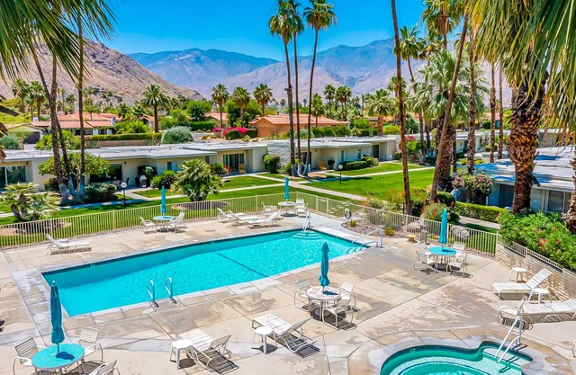 Color-filled charmer with pool & tennis access, patios, and AC
