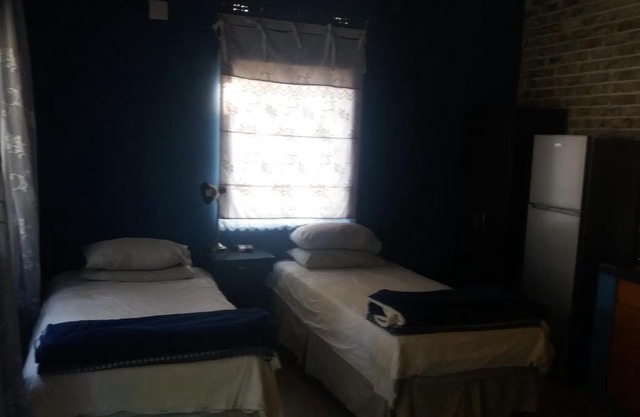 Comfy room with dstv and aircon in convenient location