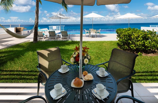 Condo 101, Swimming pool level oceanfront condo, Pristine grounds and pool!