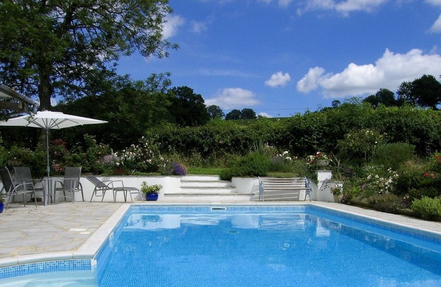 Cottage with Outdoor Pool in Gardens. Peaceful Location with Great Views.