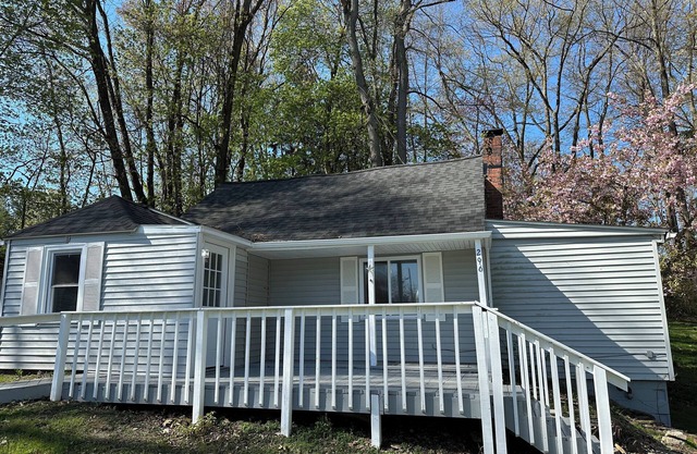Cozy cottage near The Portage Lakes that sits on a beautiful oversized lot.