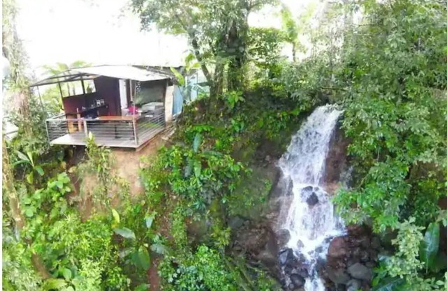 Cozy cabana with waterfall view
