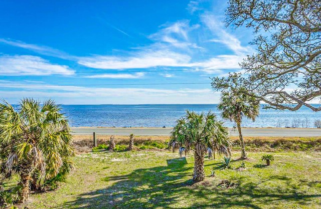 Dog-friendly home with lovely water view, roomy deck, fast WiFi, central AC, W/D