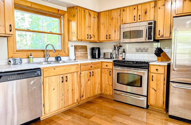 Dog-friendly lakeside charmer with deck, dock access, & wood-burning fireplace