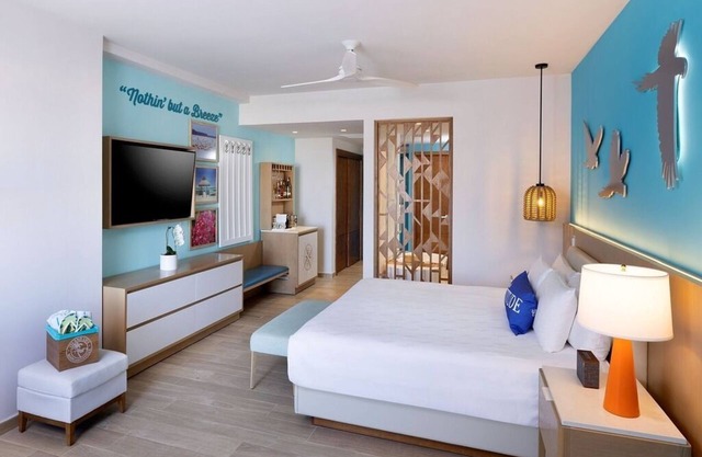 Elegant Art Suite: Freestanding Tub, Rainforest Showers, and Premium Benefits