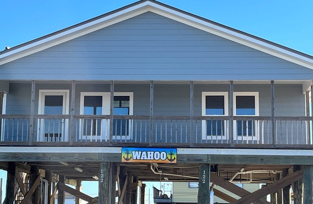 Experience waterfront living at Wahoo in Grand Isle, LA, with boat access and cozy amenities.