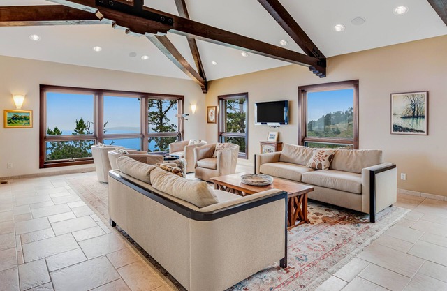Exquisite home with remarkable ocean views, fireplace & generous patio