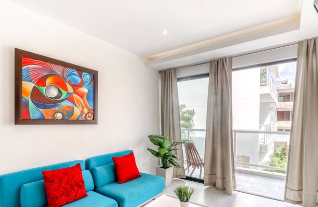 Family-friendly getaway with a balcony, partial AC, WiFi, kitchen & shared pool!