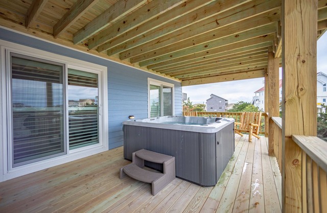 Grand beach home with elevator, private hot tub, game room, & pool access