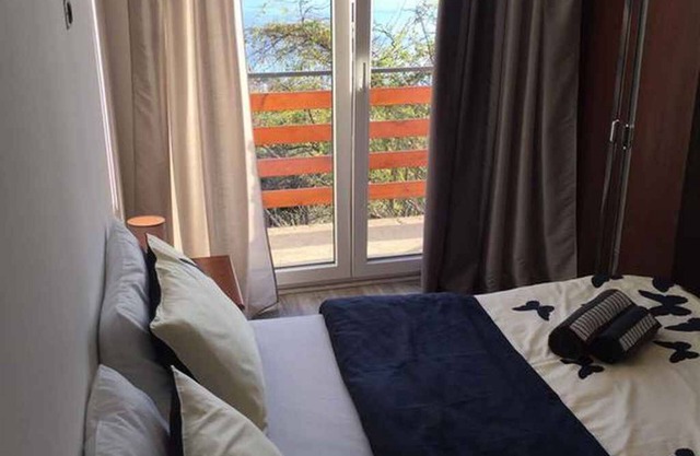 Holiday apartment with balcony and sea view