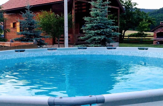 Holiday home with outdoor swimming pool and garden