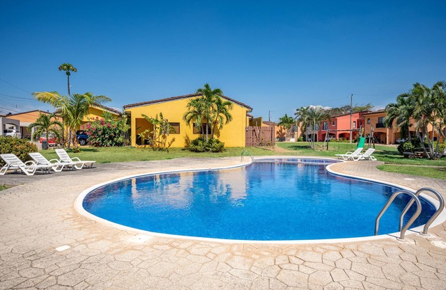 Home in a gated community with outdoor pool, patio, grill, streaming, W/D, & AC