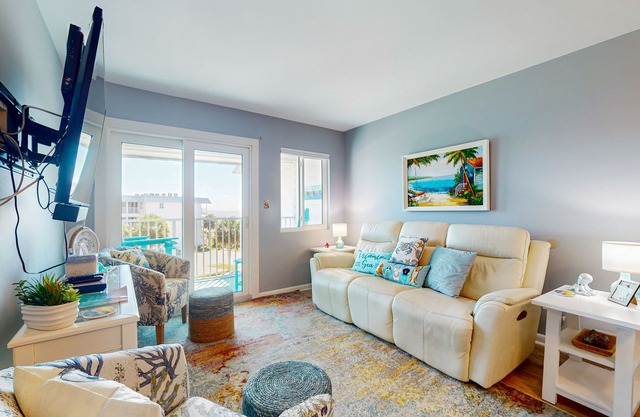 Hotel condo features beach access, shared pool - near town