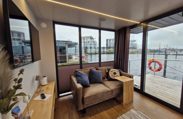 Houseboat Fjord Cumulus with bio sauna and roof terrace in Wendtorf/Kiel Fjord