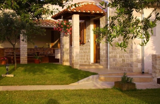 in a village with garden, air condition and barbecue