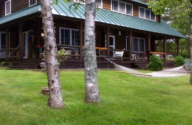 Justawhim-Private Lakefront Log Lodge with Old World Charm steps from the water.