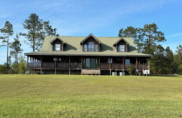 Kennedy Family Cabin- a large log cabin in a rural, farming community