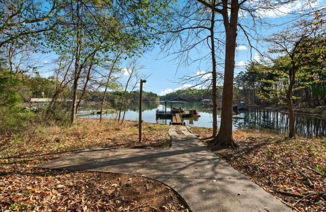 Lake front with dock home in charming Fair Play with AC, fitness room