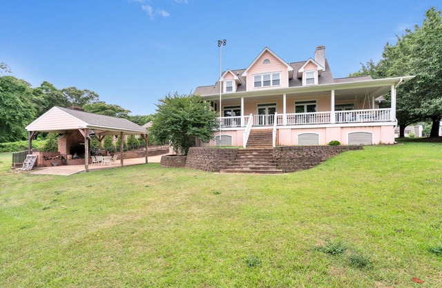 Lakefront home on a calm cove sitting on 4 acres!