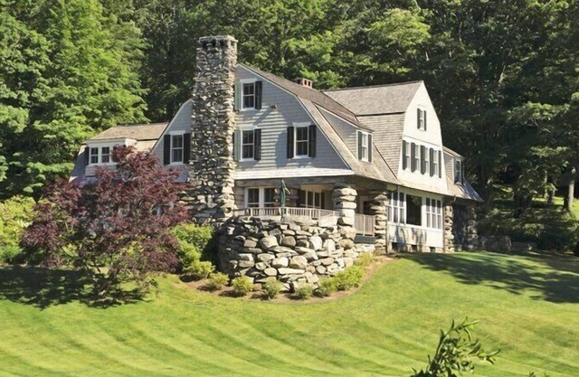Lakefront Home set on five acres of land, deck, patio, lounge seating by...