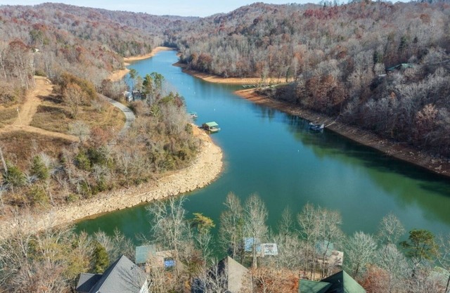 Lakefront home that can sleep 15 with private dock and hot tub in private cove!