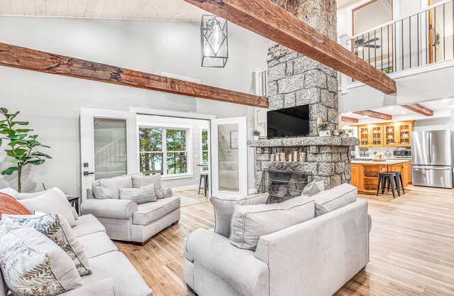 Lakefront, newly rebuilt, dog-friendly home with private beach, dock & firepit