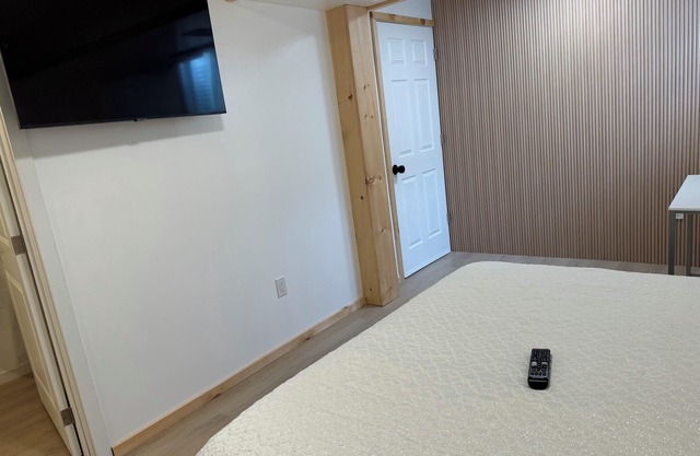 Large bedroom with private bathroom and workspace.