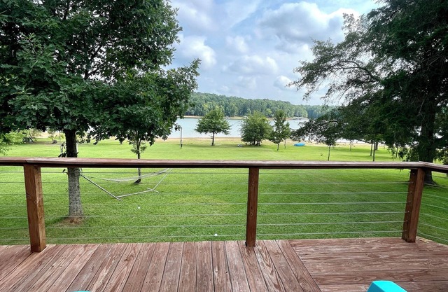 Light & Airy Lakefront Home with Flat Yard, Private Dock, Deck & Screened Porch