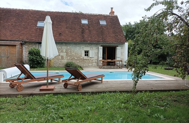 Longère (traditional long house) with swimming pool in a green setting