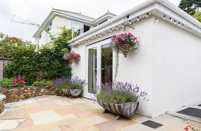 Lovely holiday home with unique and beautifully landscaped paved garden.