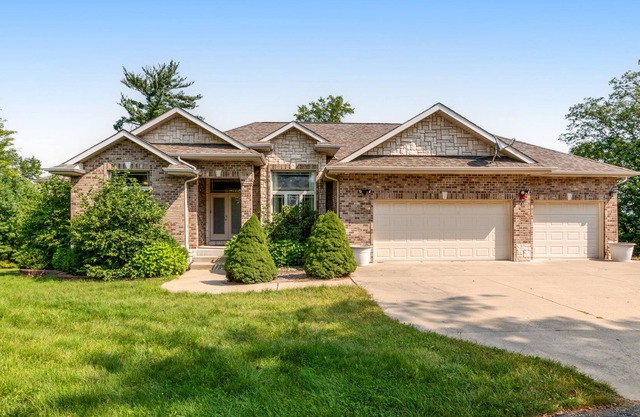 Lovely river-view retreat with big yard, deck, & patio - dog-friendly