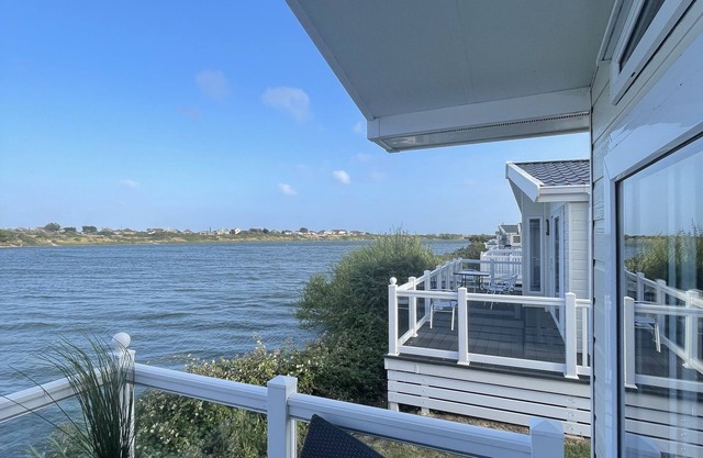 Luxury 3 bedroom waterside lodge, a stones throw from Pagham beach and harbour.