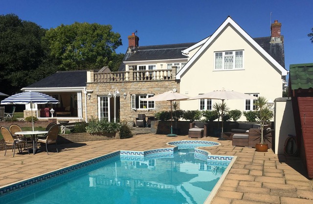 Luxury five bed home with heated pool and large gardens
