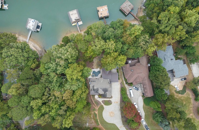 Luxury Lakefront retreat. Privacy gate, pool and outdoor kitchen